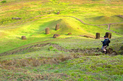 Full length of man walking on steps by mountain at easter island