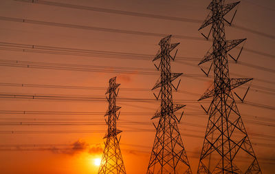 High voltage electric pylon and electrical wire with sunset sky. electricity poles. power and energy