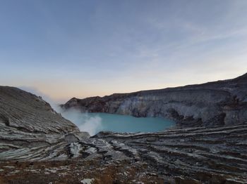 Scenic view of mountains against sky during sunset. ijen - indonesia