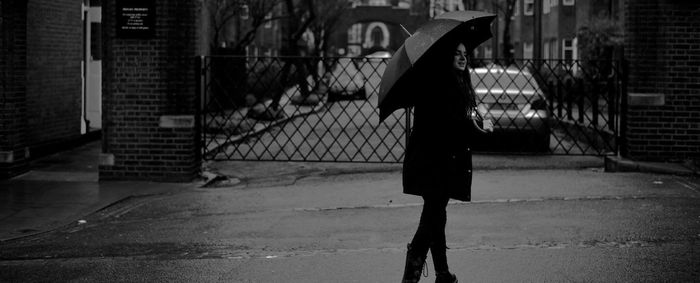 Woman walking on zebra crossing