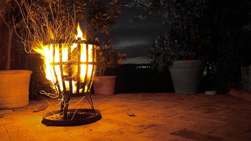 Illuminated chairs at night