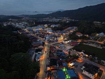High angle view of illuminated cityscape against sky
