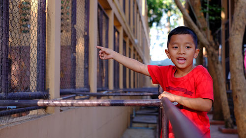 Portrait of boy standing outdoors