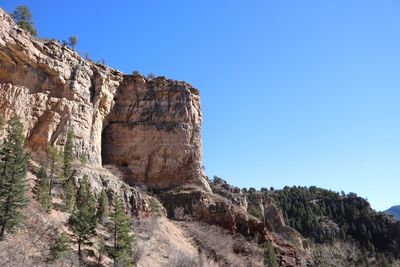 Rock formation against clear blue sky