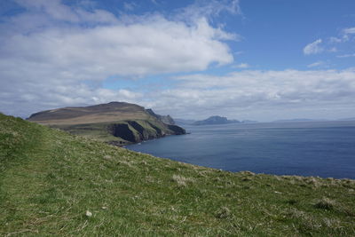 Scenic view of sea against cloudy sky