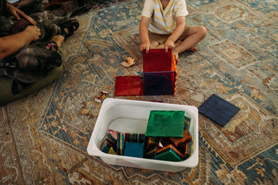 Anonymous portrait of young boy playing with magnet tiles