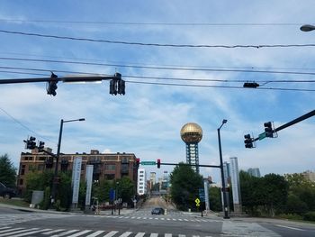 Street lights against sky in city