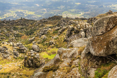 Rock formations on landscape against sky