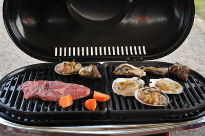 High angle view of food on barbecue grill