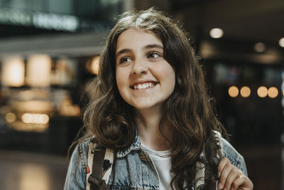 Happy girl laughing at railroad station