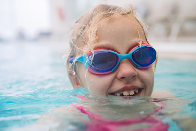 Close-up of woman swimming in pool