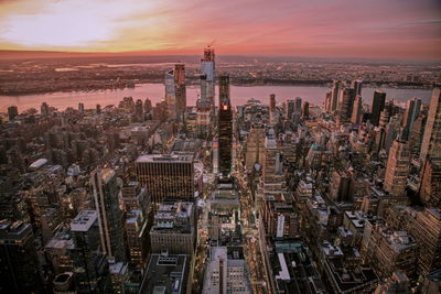 High angle view of city against sky during sunset