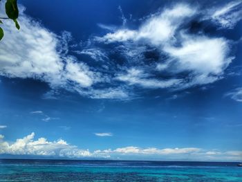 Low angle view of sea against blue sky