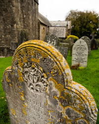 Close-up of cross in cemetery