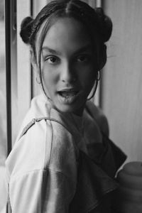 Portrait of beautiful teenager with open mouth at home