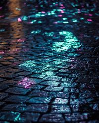 Wet street shining at night