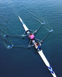 High angle view of women rowing on river