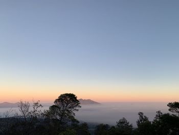 Scenic view of silhouette landscape against clear sky at sunrise