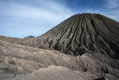 View of volcanic landscape against sky