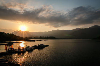 Scenic view of lake against sky during sunset