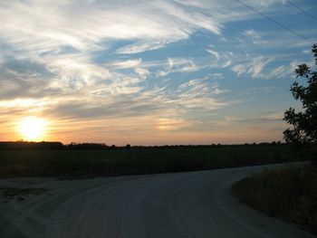 Road passing through field