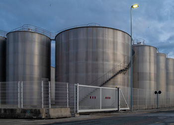 Low angle view of factory against sky