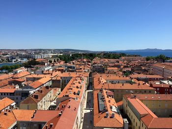 Townscape against clear blue sky