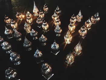 High angle view of illuminated lamp hanging on glass