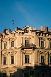 Low angle view of building against blue sky