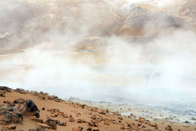 Smoke emitting from volcanic mountain