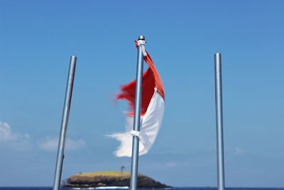 Low angle view of flag against sky