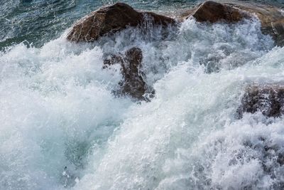 Waves splashing on rocks