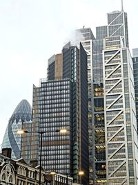 Low angle view of modern buildings against sky