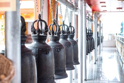 Close-up of metal bells in temple