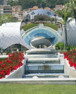 Building by swimming pool in park