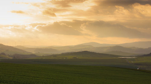 Scenic view of landscape against sky during sunset