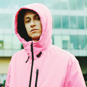 Portrait of woman with pink hair standing outdoors