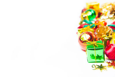 Close-up of christmas decorations over white background