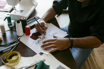 High angle view of man working on table