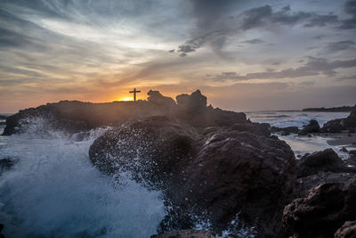 Water splashing on rocks on sea