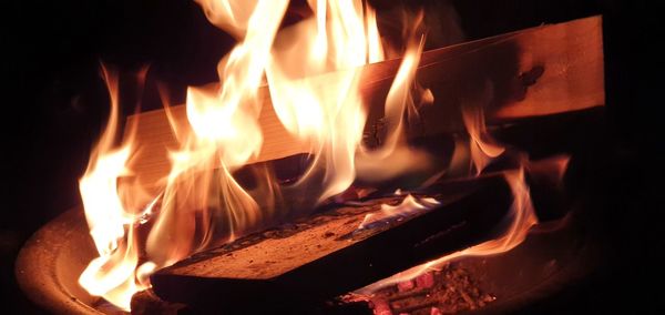 Close-up of fire burning at night