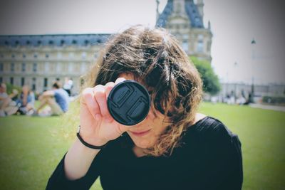 Close-up of young woman looking at camera