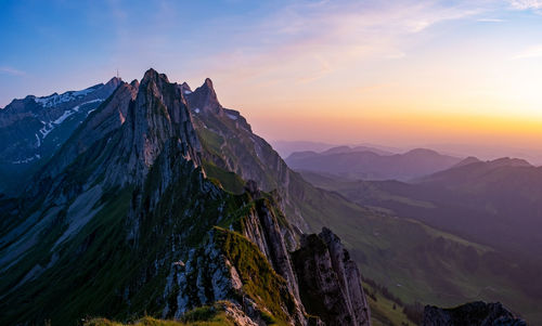 Panoramic view of mountains against sky during sunset