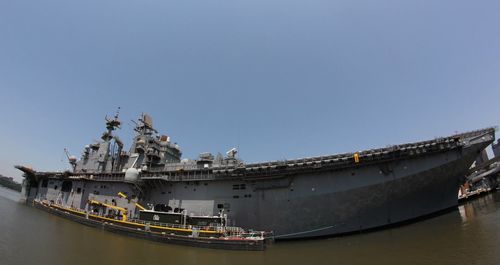 Panoramic view of ship at harbor against blue sky