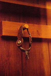 Close-up of key hanging on door