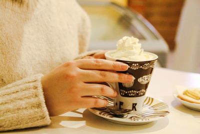 Close-up of woman holding ice cream