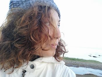 Portrait of girl looking at shore