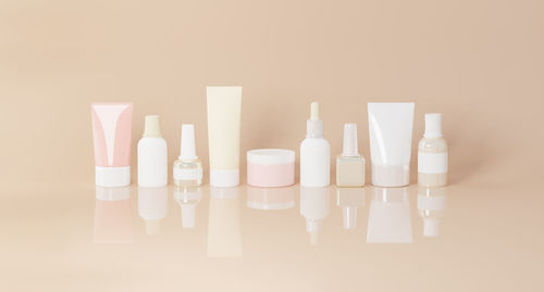 Close-up of bottles against yellow background