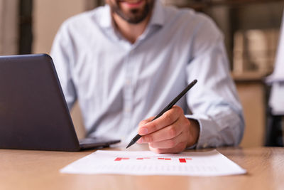 Man using laptop on table