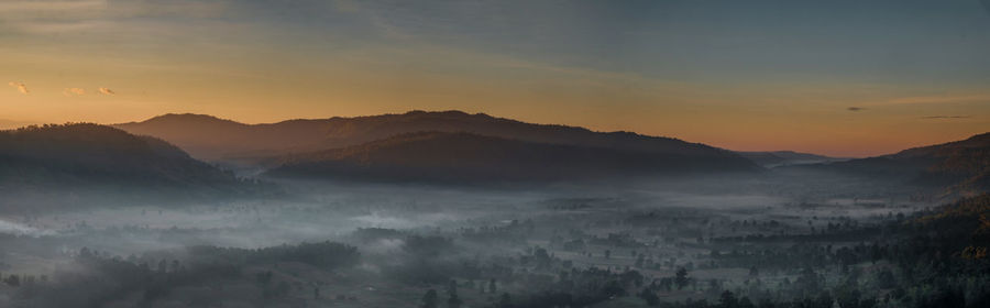 Scenic view of mountains against sky during sunset